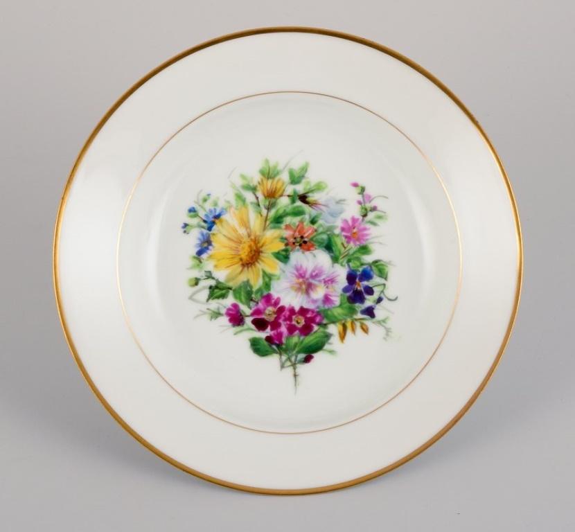 Hand-Painted Bing & Grøndahl, four deep plates in porcelain with flowers and gold decoration For Sale