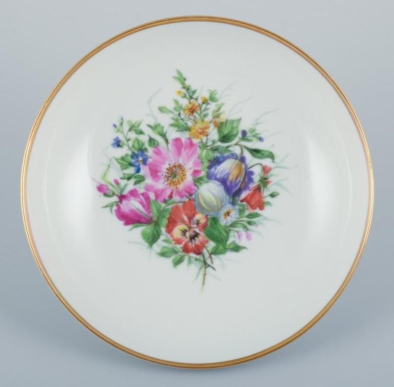 Bing & Grøndahl, a hand-painted sauceboat and bowl decorated with polychrome flowers.
From the early 1900s.
In perfect condition.
First factory quality.
Marked.
Sauceboat: Width 22.0 cm x Depth 15.5 cm x Height 11.0 cm.
Bowl: Diameter 21.0 cm x