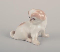 Bing & Grøndahl, porcelain figurine of a Pekingese puppy. Approx. 1930