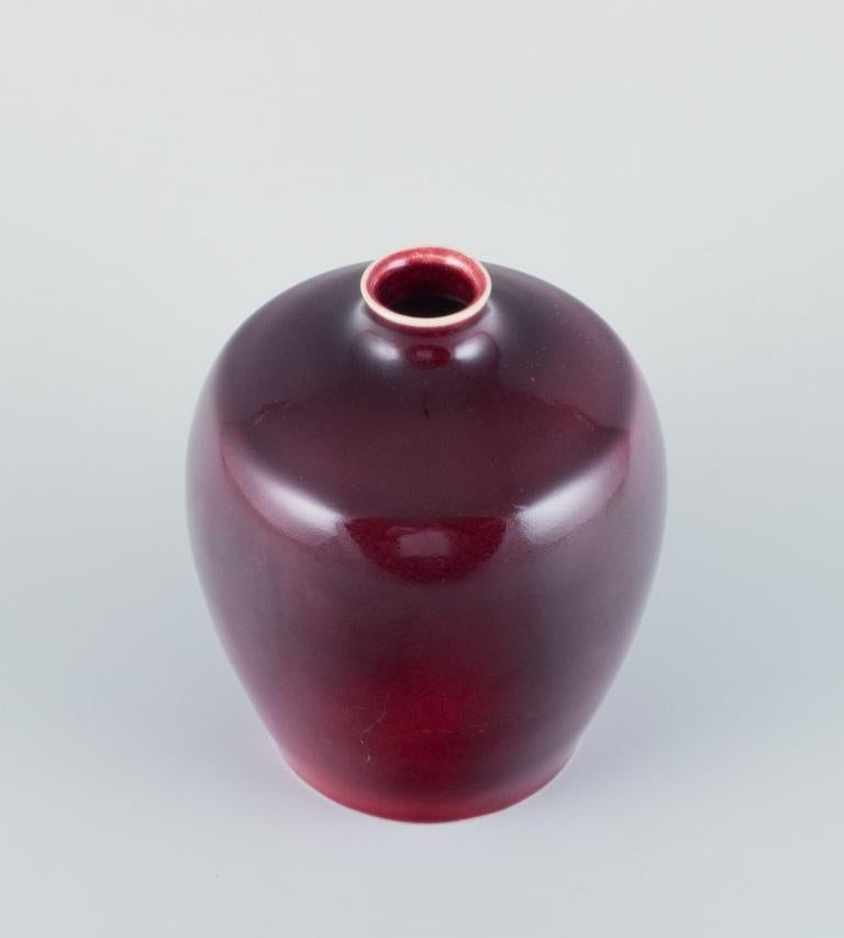 Danish Bing & Grøndahl porcelain vase decorated with ox blood glaze. 1930s For Sale