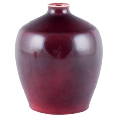 Bing & Grøndahl porcelain vase decorated with ox blood glaze. 1930s