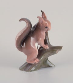 Bing & Grøndahl. Rare porcelain figurine of a squirrel on a tree stump