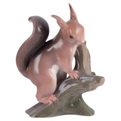 Bing & Grøndahl. Rare porcelain figurine of a squirrel on a tree stump