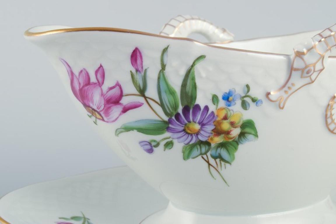 Early 20th Century Bing & Grøndahl, Saxon Flower, hand-painted sauce boat with handles. For Sale