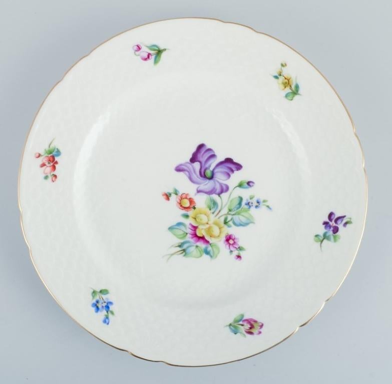 Hand-Painted Bing & Grøndahl, Saxon Flower, set of four dinner plates decorated with flowers For Sale