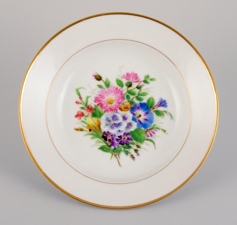 Early 20th Century Bing & Grøndahl, six deep plates in porcelain hand-painted with flowers For Sale