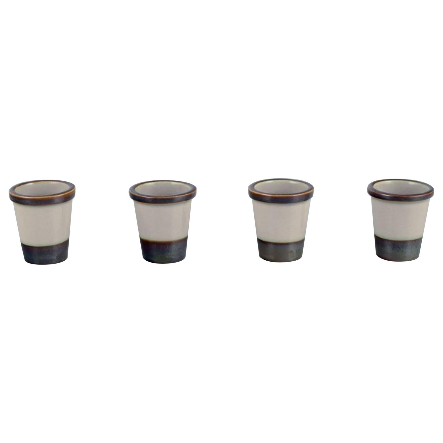 Bing & Grøndahl, Tema. Four egg cups in stoneware. From the 1970s.