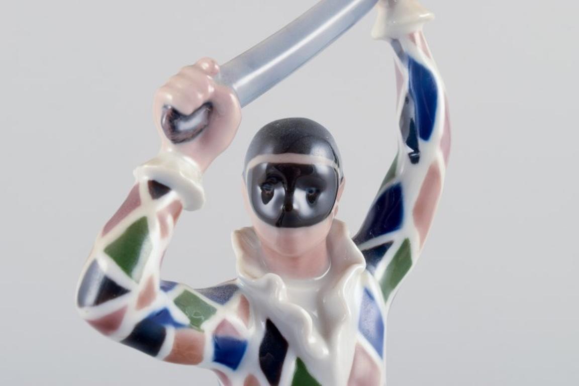 20th Century Bing & Grondahl. Porcelain figure of Harlequin. Designed by Ebbe Sadolin. For Sale