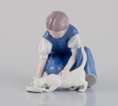 Bing & Grondahl porcelain figurine. Girl with cat.  Mid 20th c.