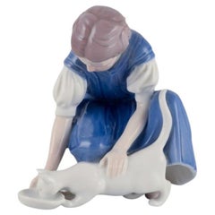 Bing & Grondahl porcelain figurine. Girl with cat.  Mid 20th c.