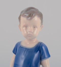 Bing & Grondahl porcelain figurine. Standing boy.  Ca. 1930s. Model number: 1617