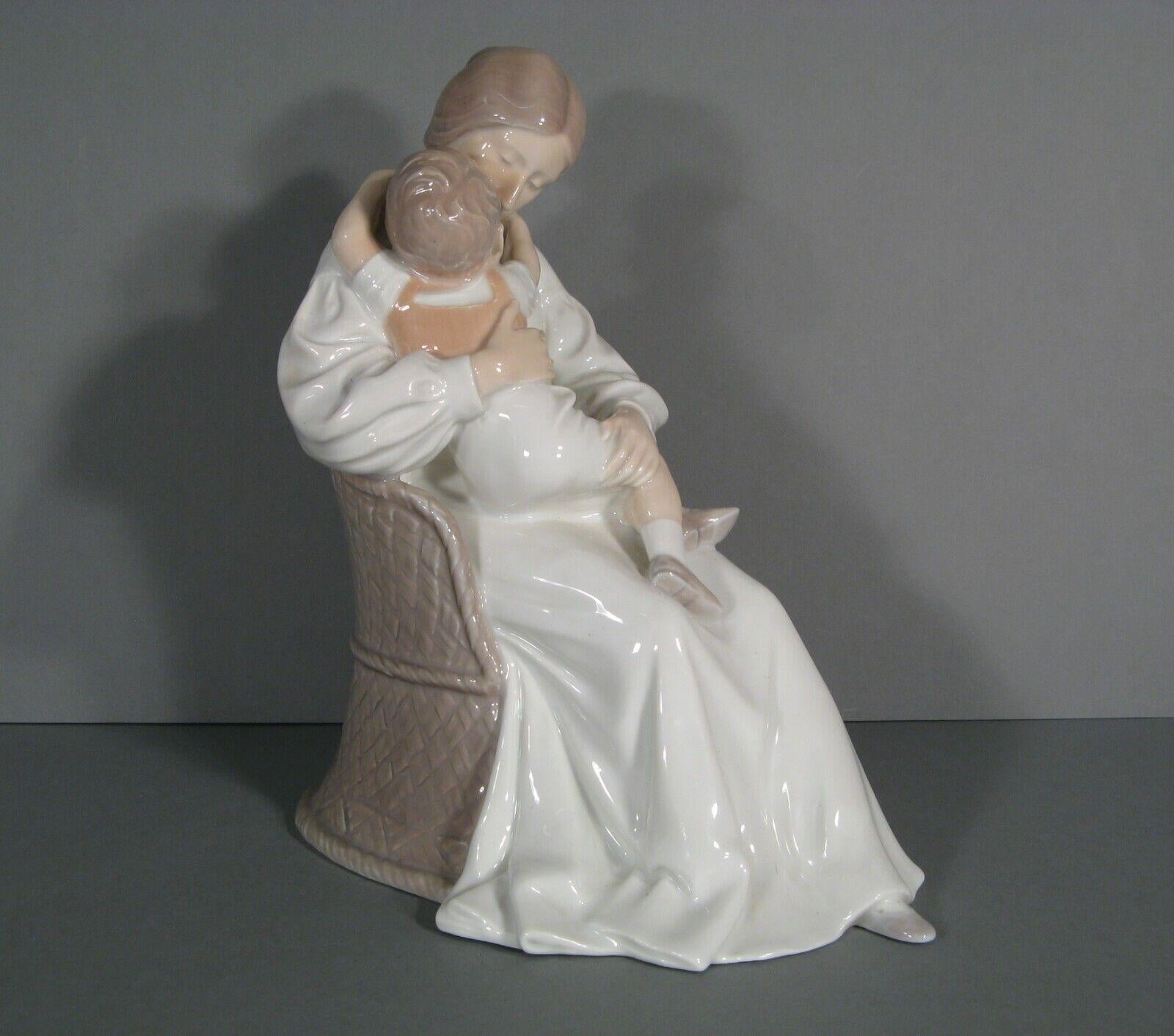 A tender and large-sized porcelain group figurine from Denmark, depicting a mother and her child in polychrome.

Material: Polychrome Porcelain
Design: Maternity Mother and Child
Manufacturer: Bing & Grondahl
Marks: Marked and numbered under the