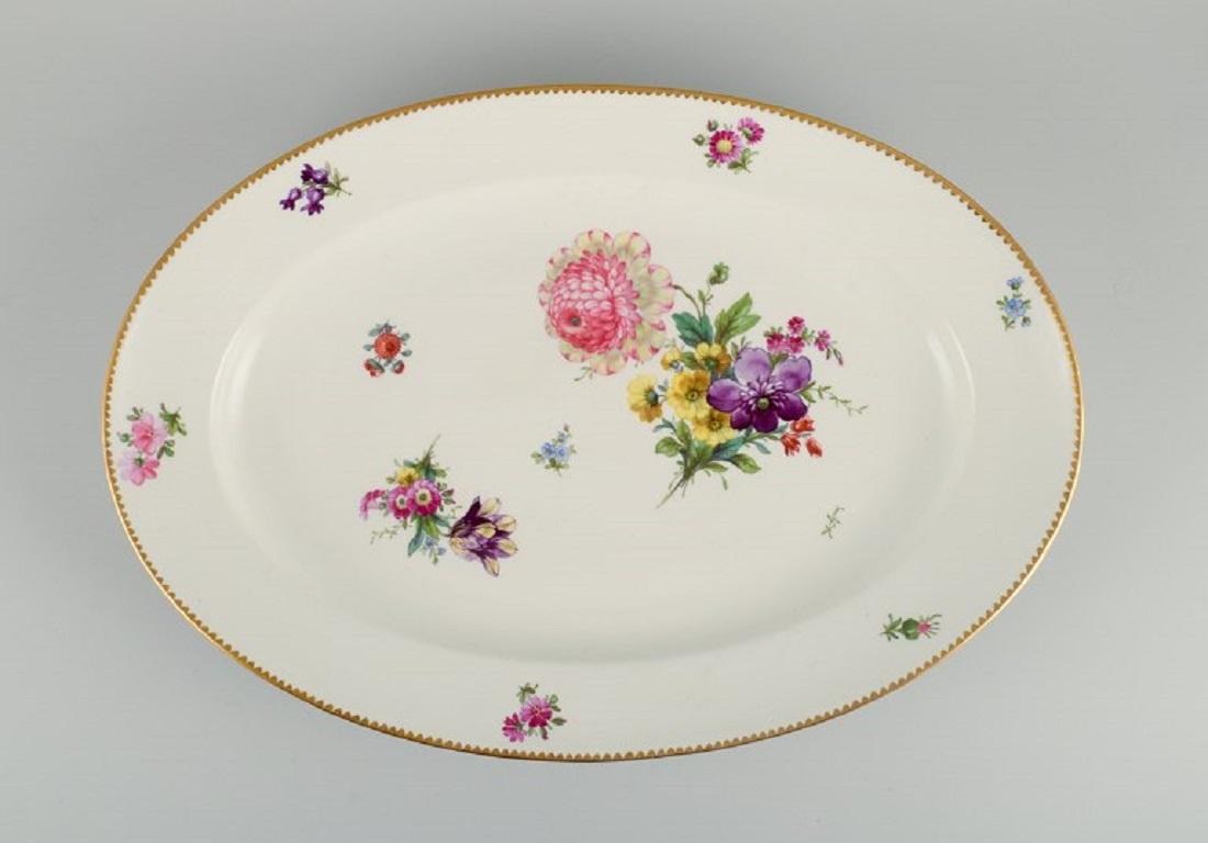 Bing & Grondahl, Saxon Flower. Large hand painted porcelain serving dish decorated with flowers and gold rim.
circa 1920s-1930s.
First factory quality.
Dimensions: L 51.0 x W 35.0 x H 5.5 cm.