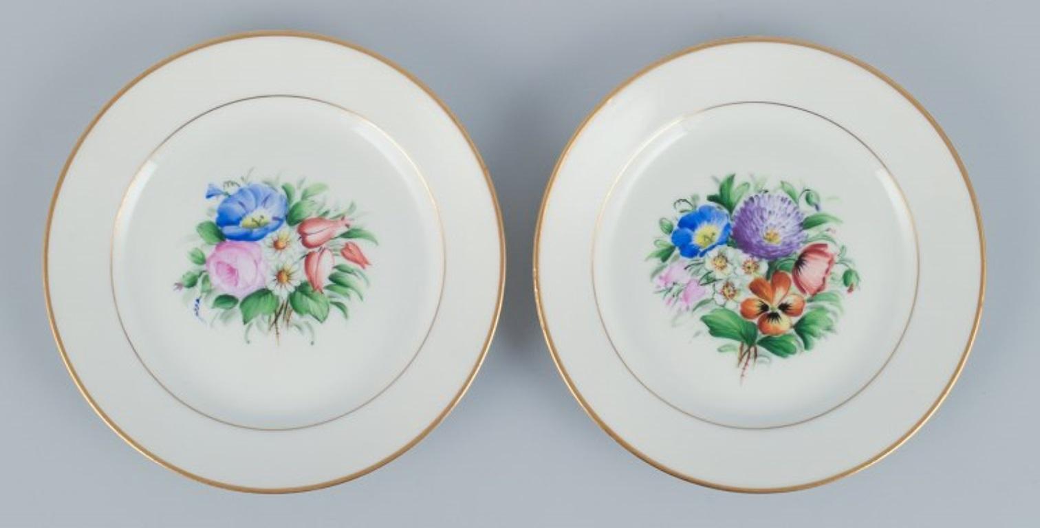 Hand-Painted Bing & Grondahl, set of fourteen plates hand-painted with flowers. For Sale