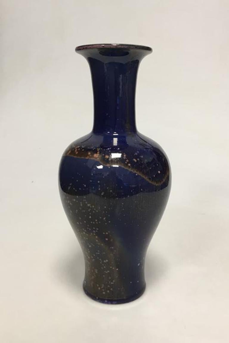 Bing & Grondahl stoneware Crystal Glaze vase by engineer H. Busch Jensen no 393

Measures 26cm high.

Best of his work I've seen.
 