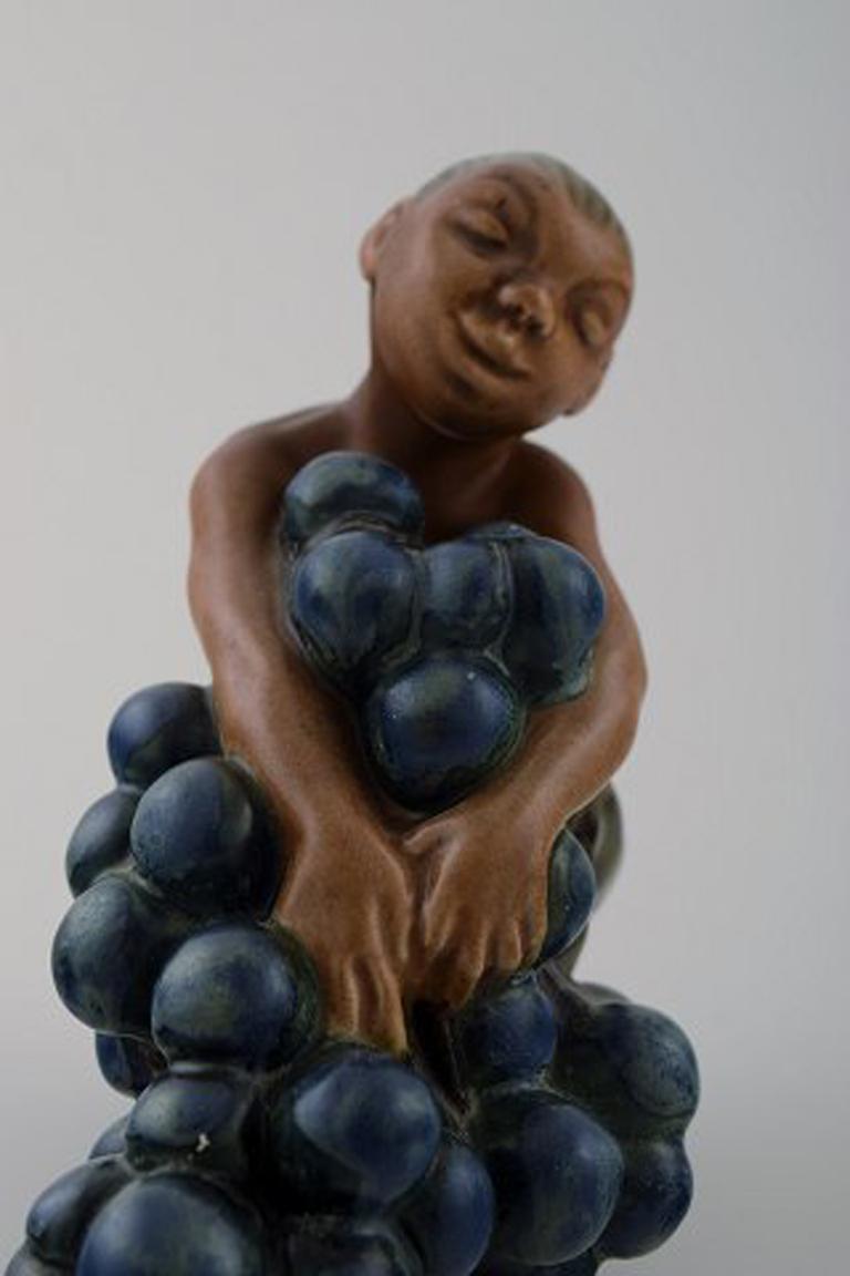 Danish Bing & Grondahl Stoneware Figurine of Small Bacchus with Bunch of Grapes For Sale