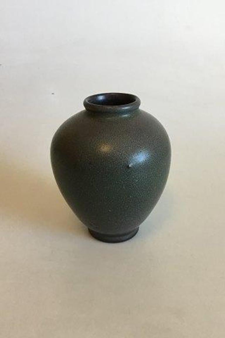 Bing & Grondahl stoneware vase No 570. Designed by H. Bisch Jensen. 

Measures 12 cm / 4 23/32 in.
   