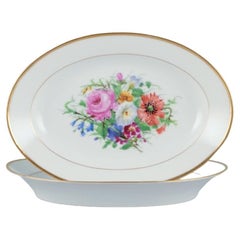Bing & Grondahl, two oval platters with flower motifs and gold rim