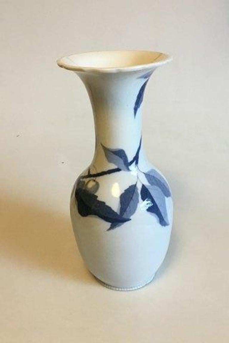 Bing & Grondahl unique vase designed by Fanny Garde. Decorated with Cherry in blue colors. 

Measures 30.5 cm / 12 1/64 in. Small chips on the foot rim. Otherwise great condition.
    