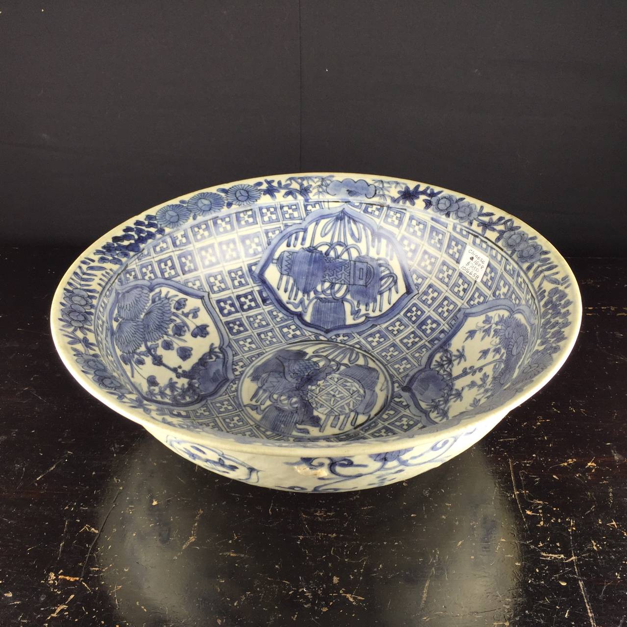 Large Ming porcelain bowl, recovered from the Binh Thuan shipwreck, Vietnam, painted with reserves of flowers and Buddhist symbols, the rim with flowers and foliage. 
Ship wrecked, porcelain slightly earlier, circa 1608.

The Bihn Thuan Shipwreck