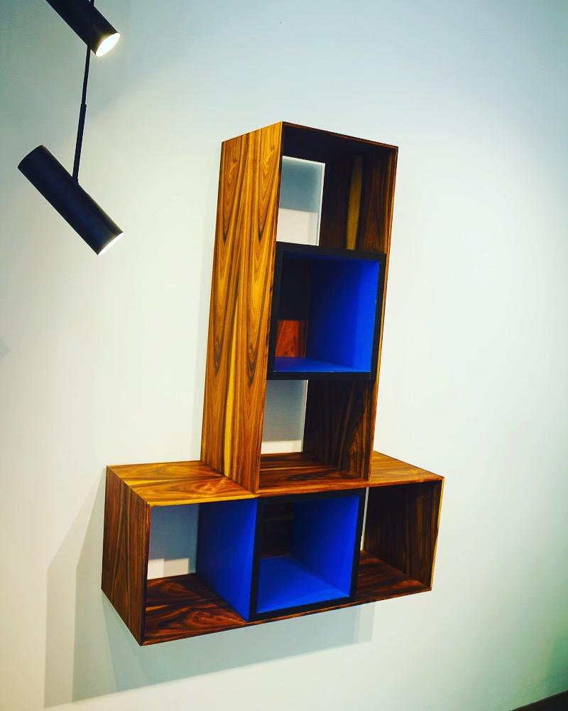 A pair of bookshelves that can be wall-mounted or self standing in different ways.