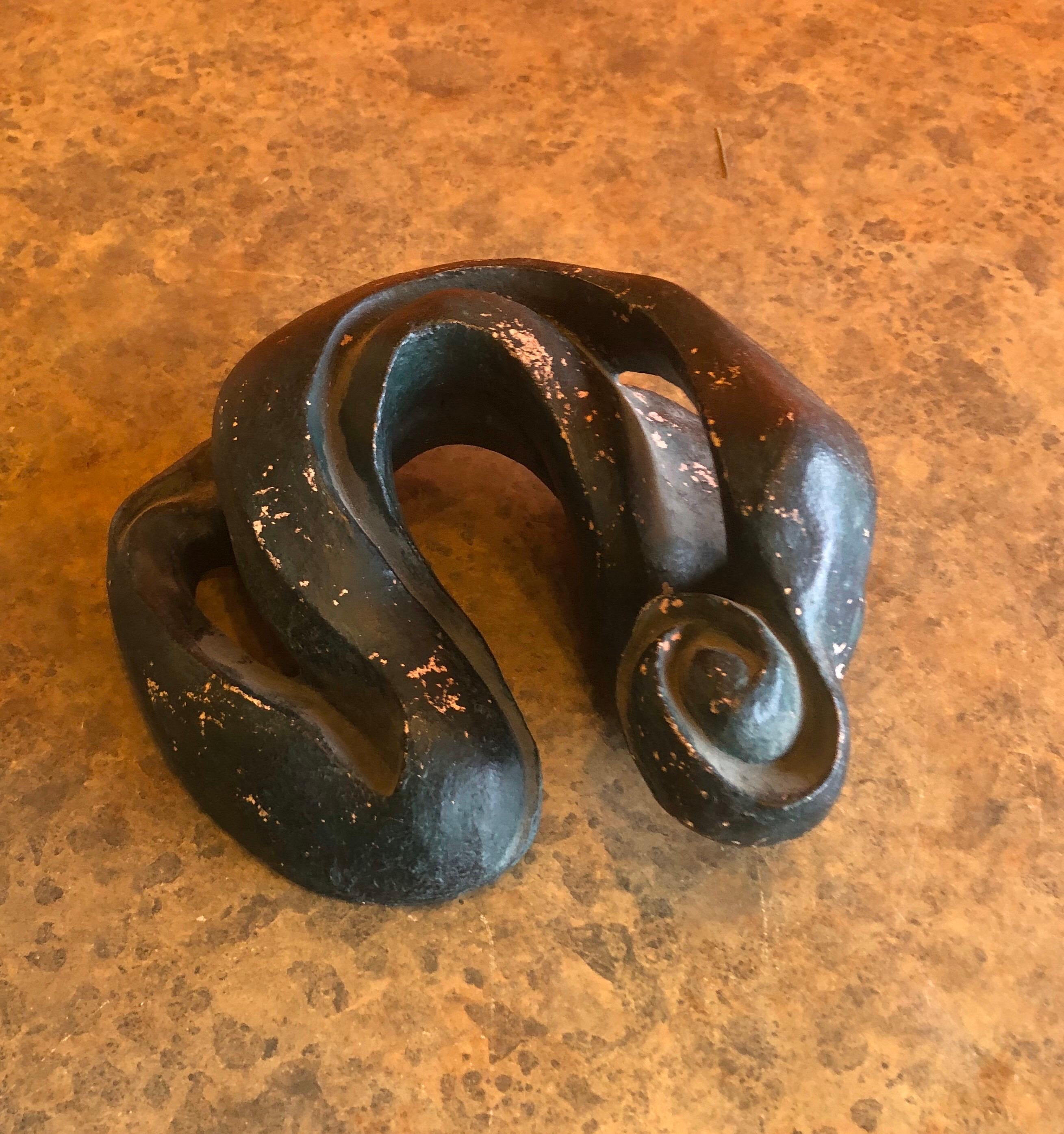 A very cool biomorphic abstact pottery sculpture by California listed artist Robert Ortlieb, circa 1970s. The piece is hand thrown terracotta pottery painted in with a flat dark green paint.