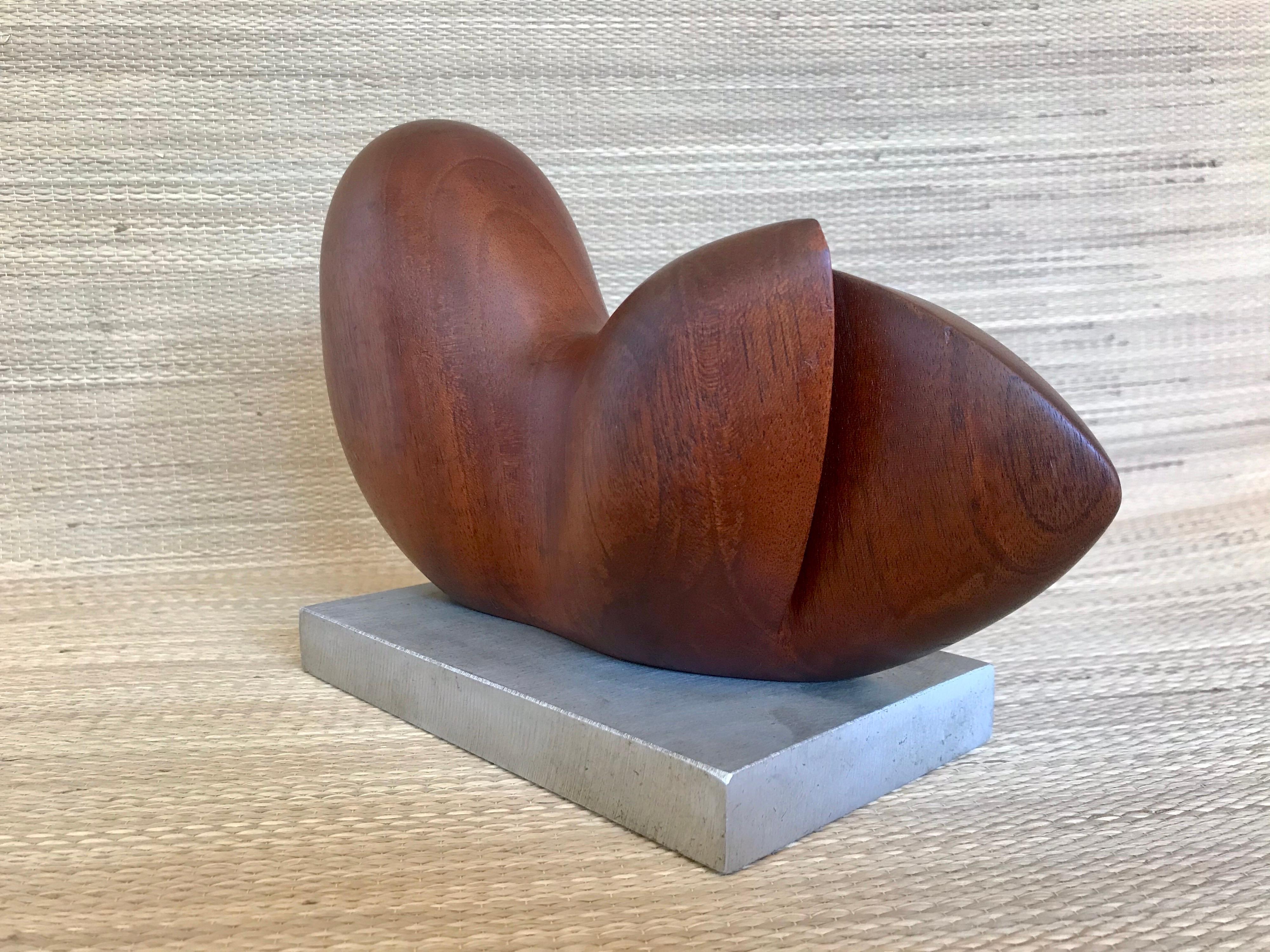 nice modernist sculpture
(also in the style of Leo Amino)
appears to be a reclining nude
finely carved solid walnut
aluminum base
fine original condition.