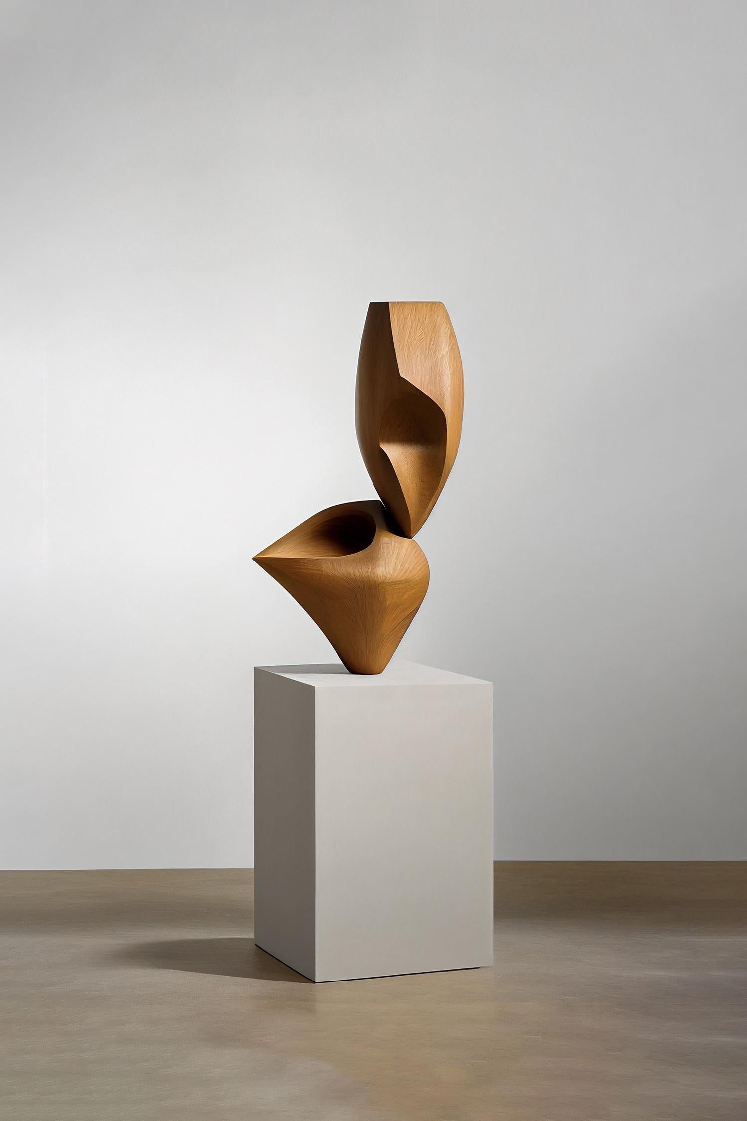 This monolithic sculpture, designed by the talented Artist Joel Escalona, is a towering example of beauty in craftsmanship. Hand and digital machine made; the standing sculpture stands tall as a monument to the skill of the artist. The wood carved