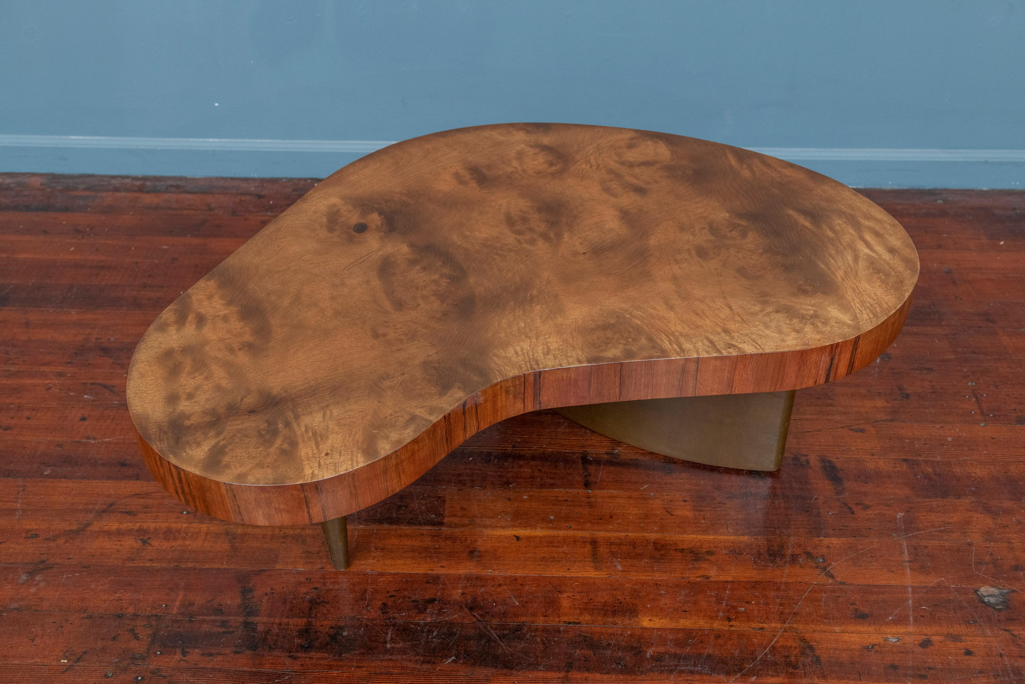 Biomorphic design coffee table designed by Gilbert Rohde for Herman Miller. An iconic design by an American master of design from Rohde's acclaimed line for Herman Miller in 1939. Made from stunning figural Paldao wood with original olive colored