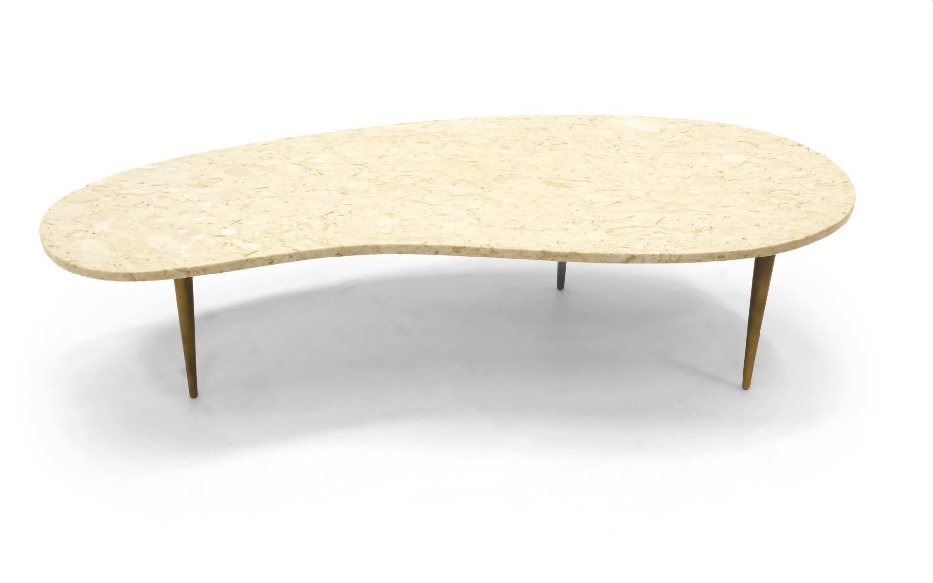 Organic form Italian coffee table. Travertine top with bronze legs.
