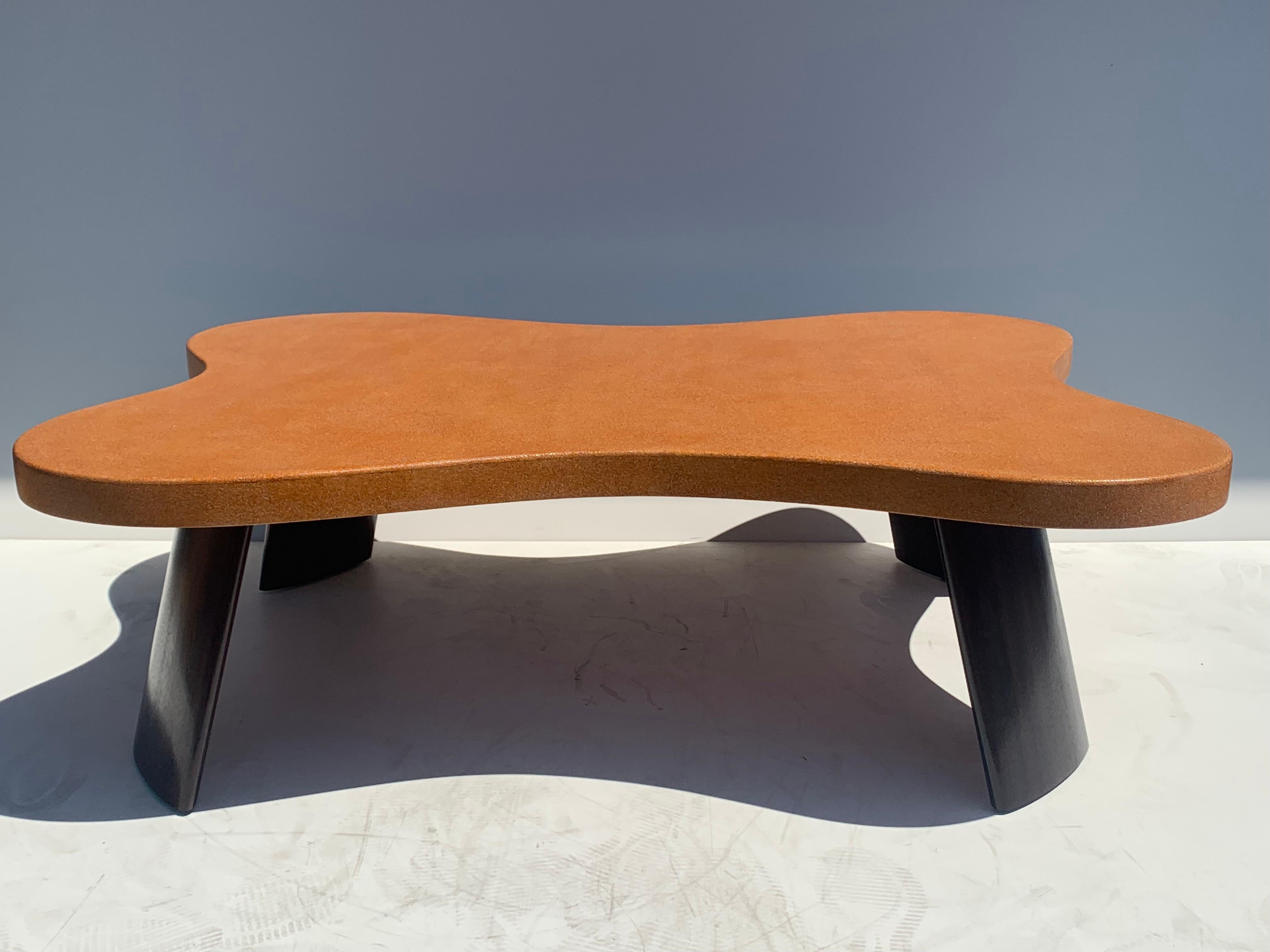 Biomorphic cork and mahogany coffee table in the style of Paul Frankl.