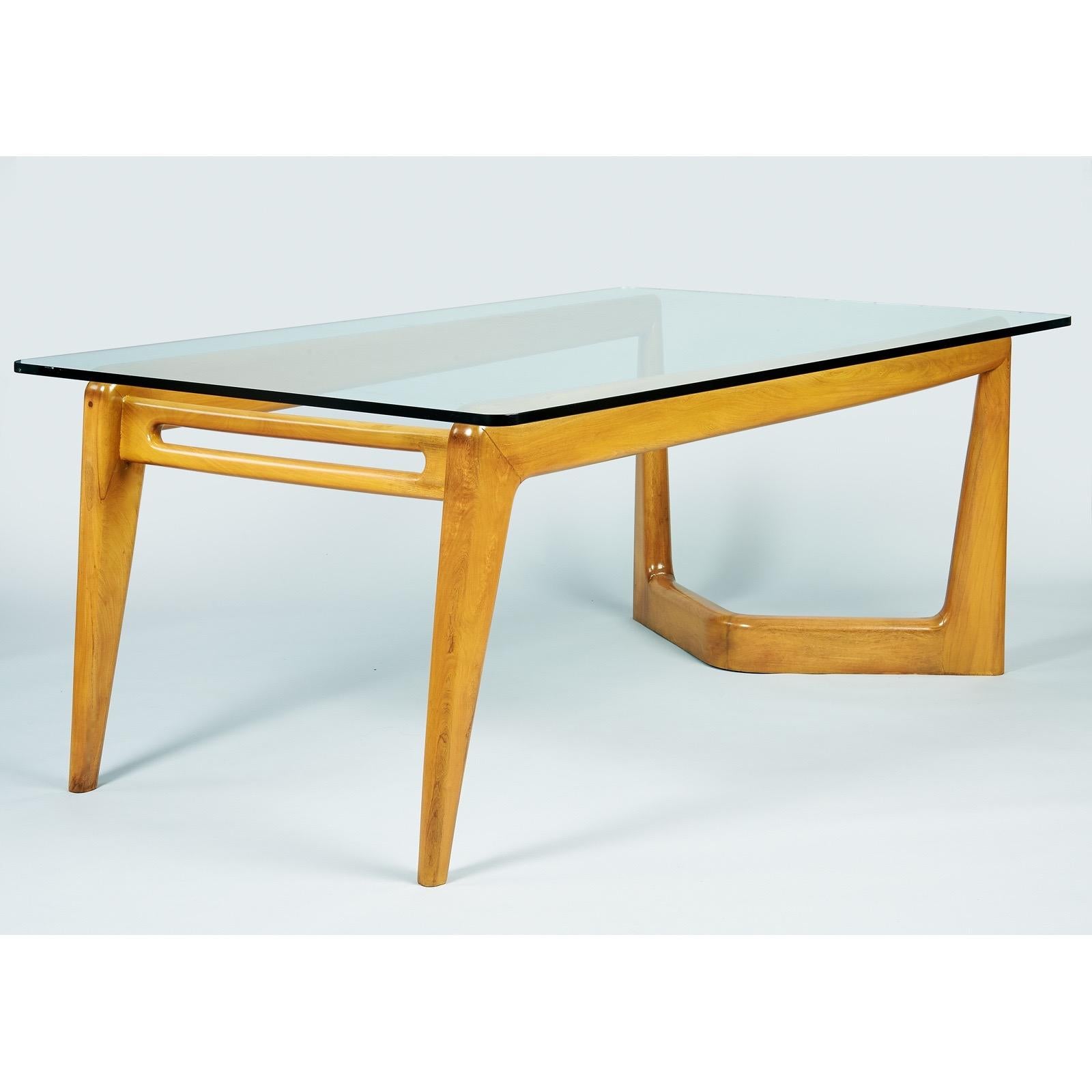 Pierluigi Giordani, (1924 - 2011) 

A monumental biomorphic dining table in polished fruitwood by pioneering Italian midcentury designer Pierluigi Giordani. The imposing sculptural base is daringly asymmetrical: On one end, it tapers into sharply