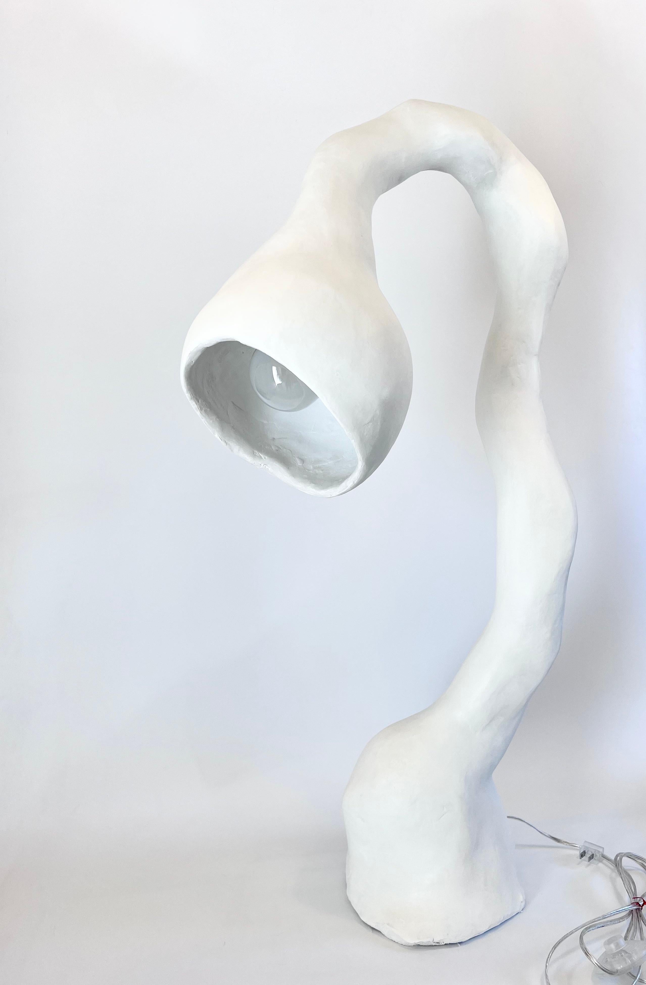 N.005 Floor Lamp from the Biomorphic Series by Studio Chora is inspired by the nature of human experience. This is a second-generation light sculpture that is hand crafted from a composite plaster-based stone. The stone composite is more durable