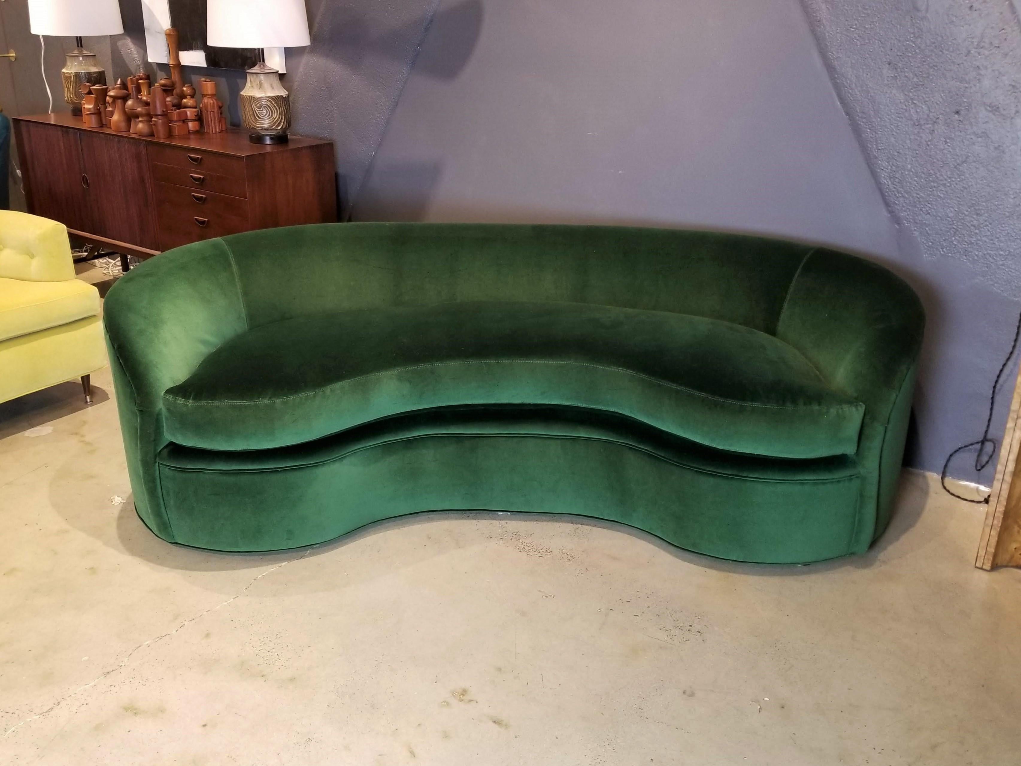 Classic biomorphic kidney bean shaped curved sofa made by Directional Furniture. Pristine, like-new condition--fully restored with all new foam and a luxe cotton blend rich emerald green velvet. 

This piece is viewable at our NYC showroom in