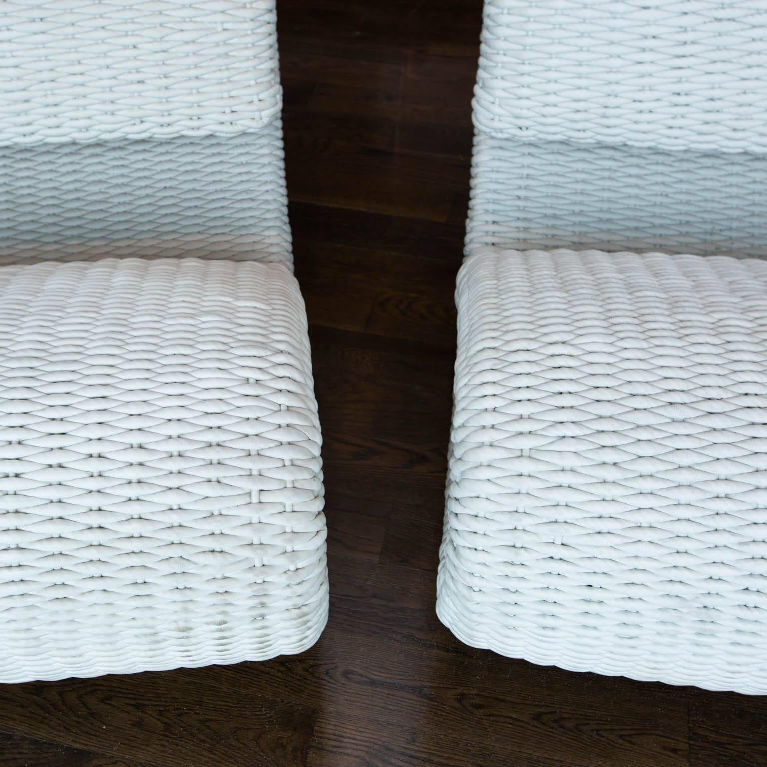 Dramatic duo of ultra modern lounge chairs in an unusual white woven leather. Chairs rest on a chrome tube. These chairs are as comfortable as they are cool.