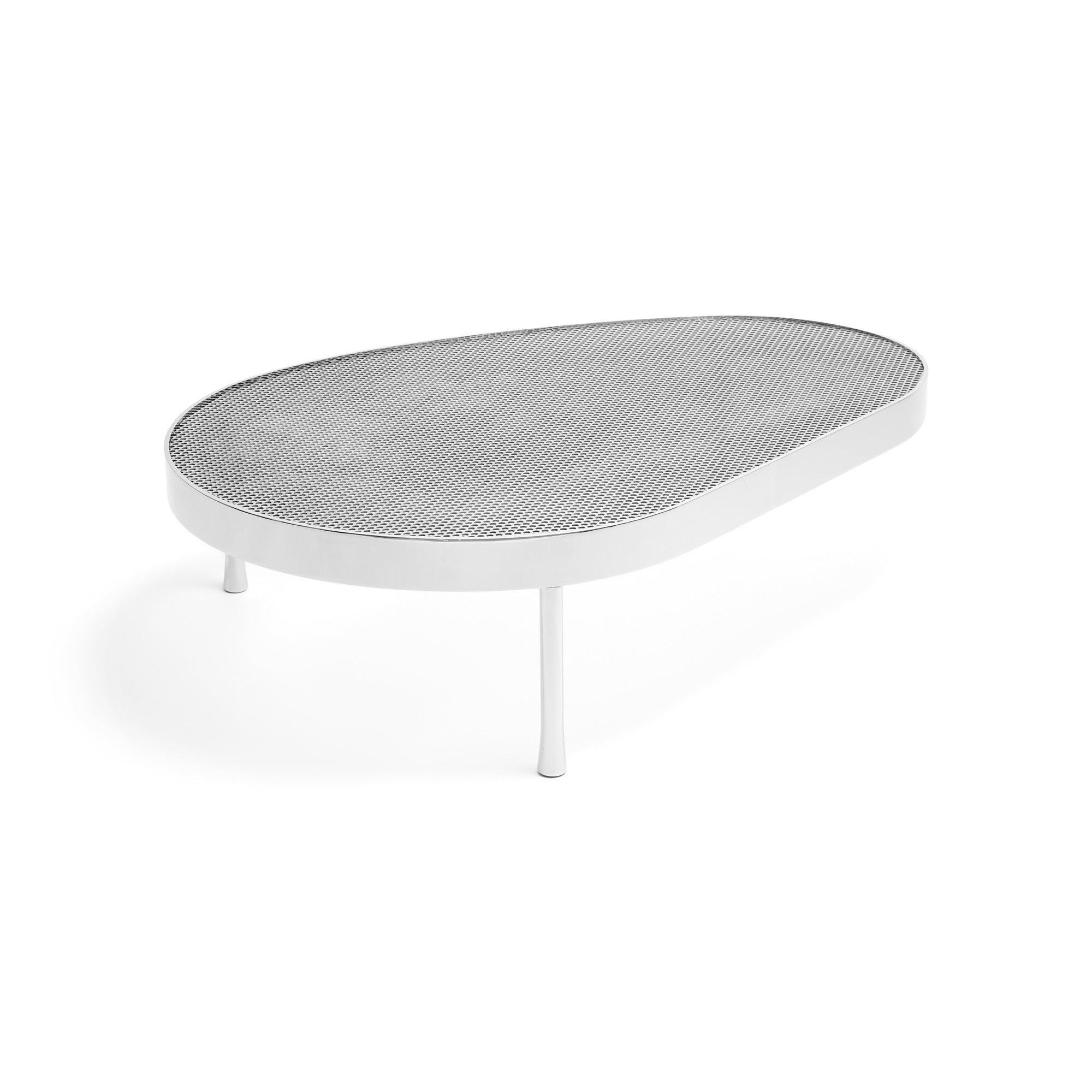 An original biomorphic shaped low table in polished stainless steel over a perforated steel top.