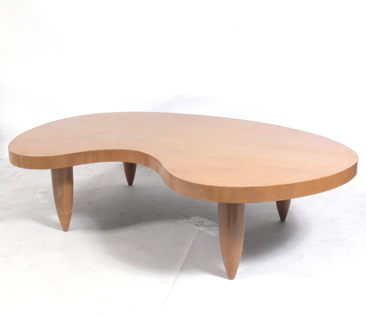 Biomorphic midcentury coffee table, in the manner of Isamu Noguchi, T.H. Robsjohn Gibbings, Jean Royere, et al, American, circa 1950s. This table is currently being refinished and can be completed in your choice of finish color. The price noted