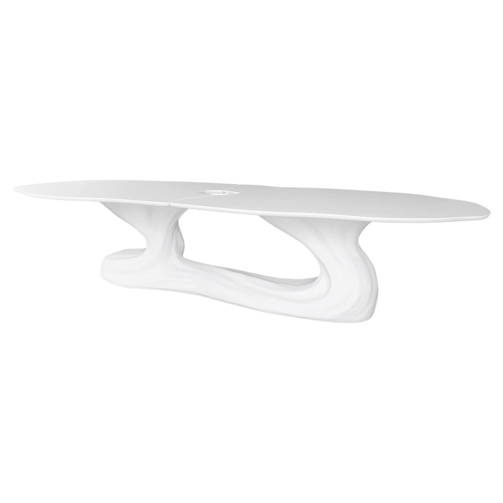 This extraordinary dining table transcends mere furniture, standing as a captivating sculptural work designed to be the focal point of any discerning exterior or interior. It is a harmonious dialogue between the raw beauty of nature and the refined