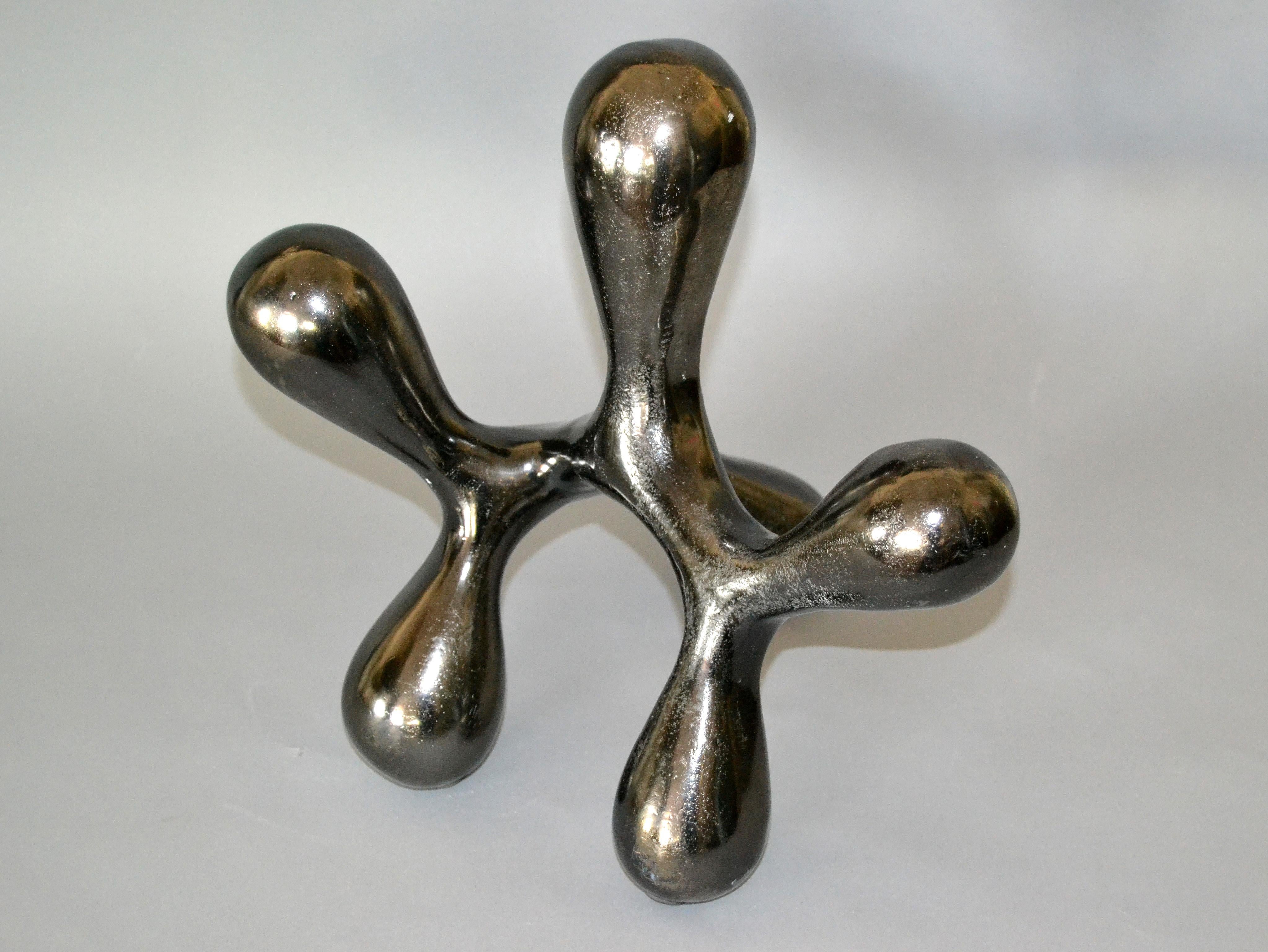 Mid-Century Modern biomorphic shape in abstract art bronze table sculpture.
No markings.
The biomorphic shape that seems to move as you change perspective.
Simply lovely.