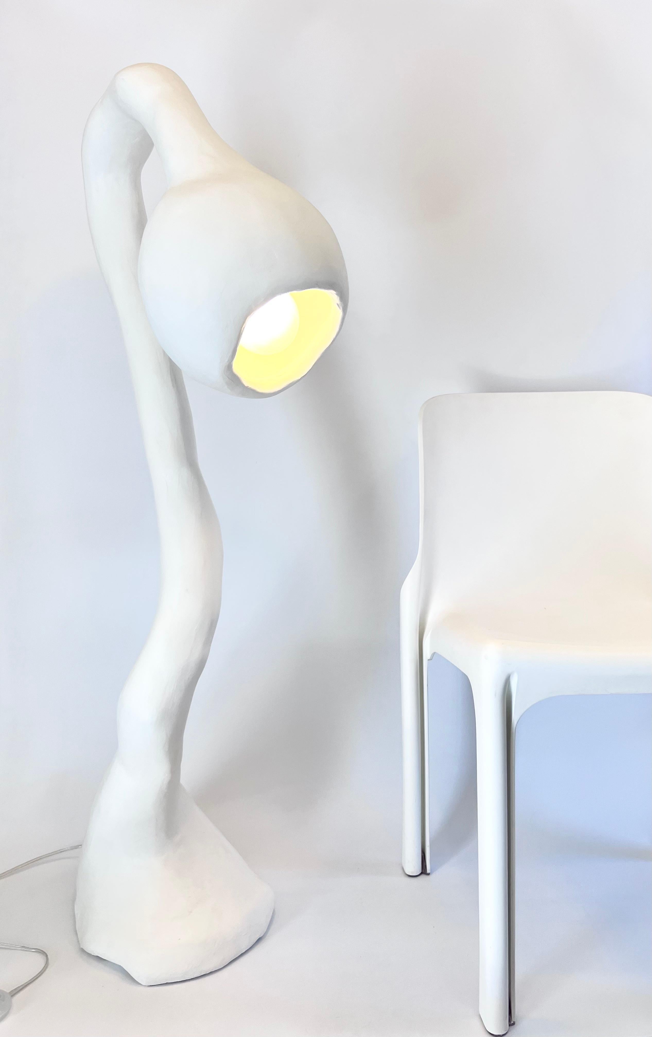 N.003 Floor Lamp from the Biomorphic Series by Studio Chora is inspired by the nature of human experience. This is a second-generation light sculpture that is hand crafted from a composite plaster-based stone. The stone composite is more durable