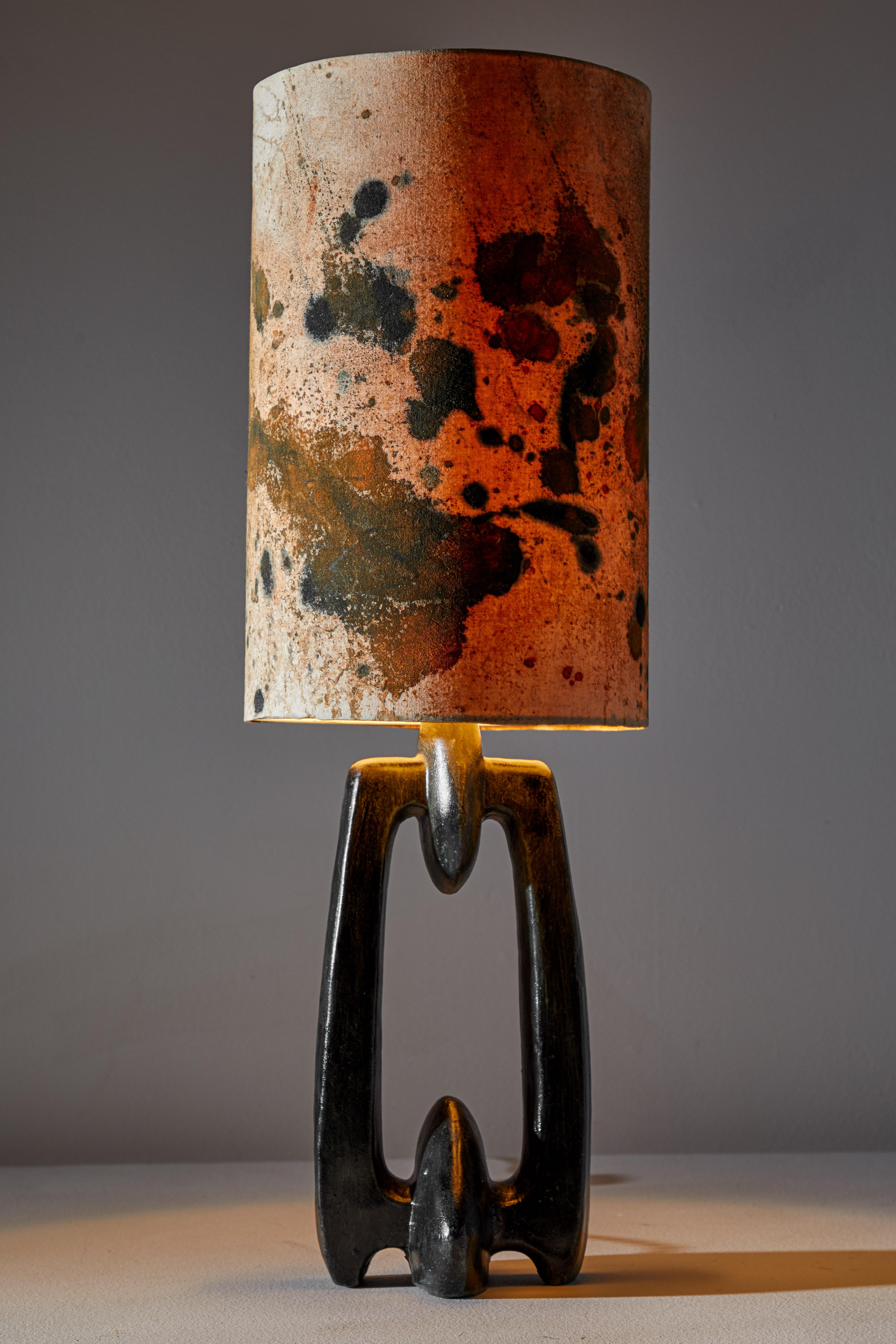 Biomorphic table lamp. Manufactured in the Netherlands, circa 1960s. Raw cotton, hand painted shade, ceramic base. Rewired with black French twist silk cord. Takes one E27 75w maximum bulb. Bulbs provided as a one time courtesy.