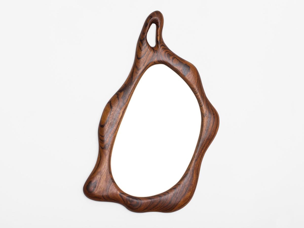 Hand carved biomorphic Zebra wood mirror by an unknown craftsperson / artist. Can hang both horizontally and vertically. Hand carved in the 1970s.