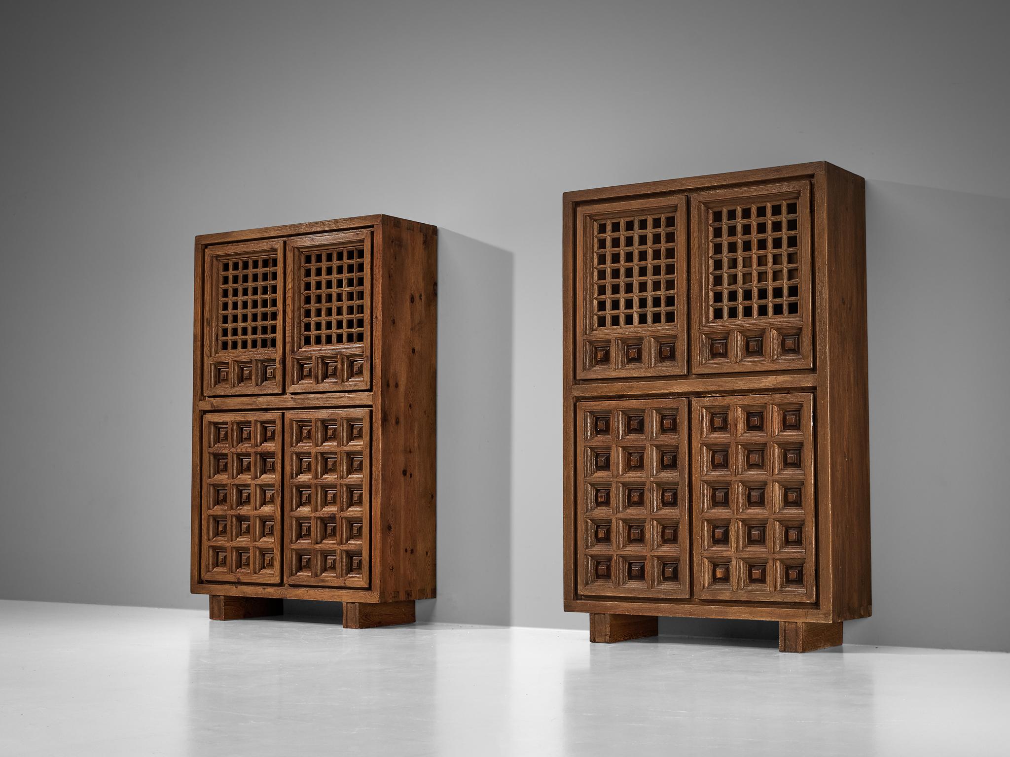 Biosca, highboards, stained pine, Spain, 1960s 

Outstanding Spanish cabinet that is executed by Biosca in an architectural way. The door panels feature a relief surface of graphic carved squares. This is very typical for Brutalist style, while the