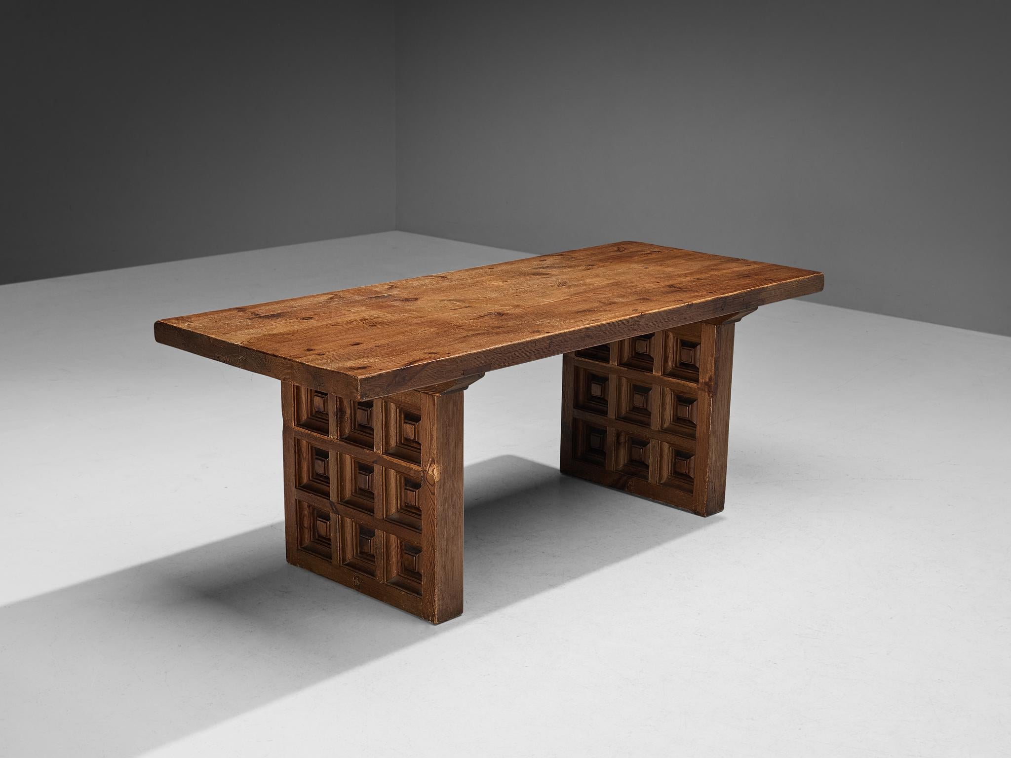 Biosca, dining table, stained pine, Spain, 1960s

Outstanding Spanish dining table that is executed by Biosca in an architectural way. The two bases feature a geometrical carved pattern, giving the table a graphic texture. This is very typical for