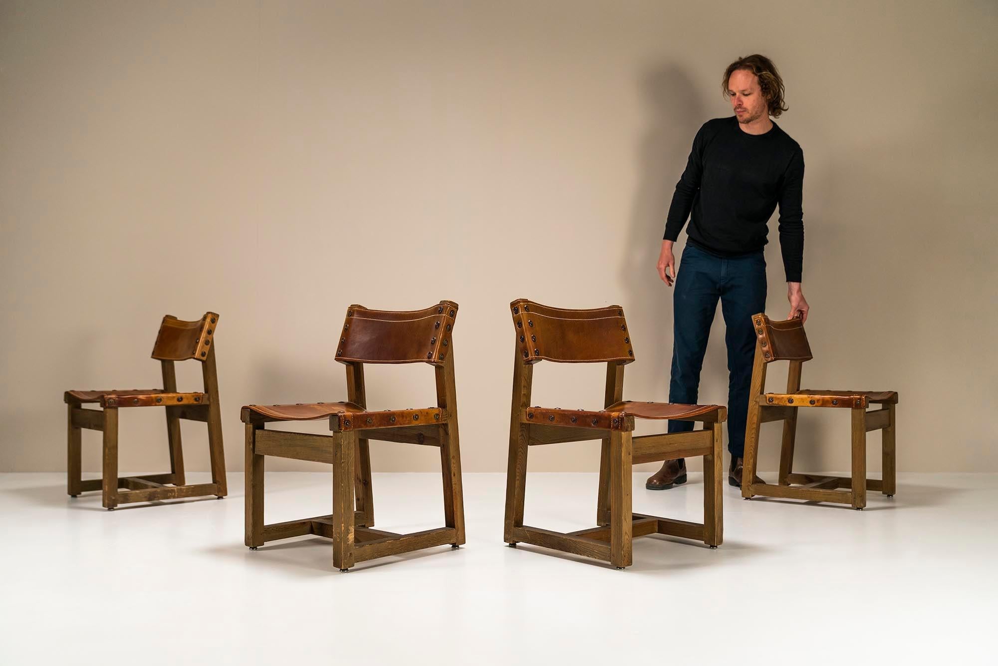 Biosca set of 4 chairs in pine and cognac saddle leather.A beautiful set of four chairs manufactured by the rather mysterious Biosca. What we also mentioned in the description of the sideboard is that little is known about this Spanish furniture