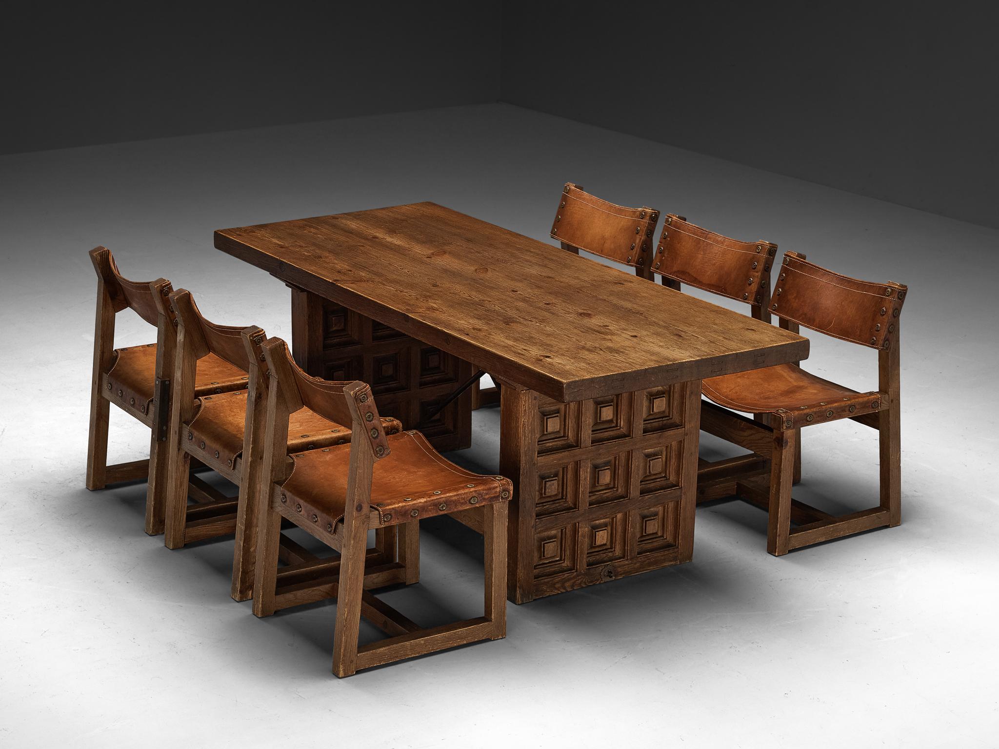 Dining room set made by Biosca containing a dining table and six chairs

Biosca, dining table, stained pine, iron, Spain, 1960s

Outstanding Spanish dining table that is executed by Biosca in an architectural way. The two bases feature a geometrical