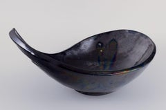 Biot, France. Large ceramic bowl with organic form. Matte glaze in dark tones