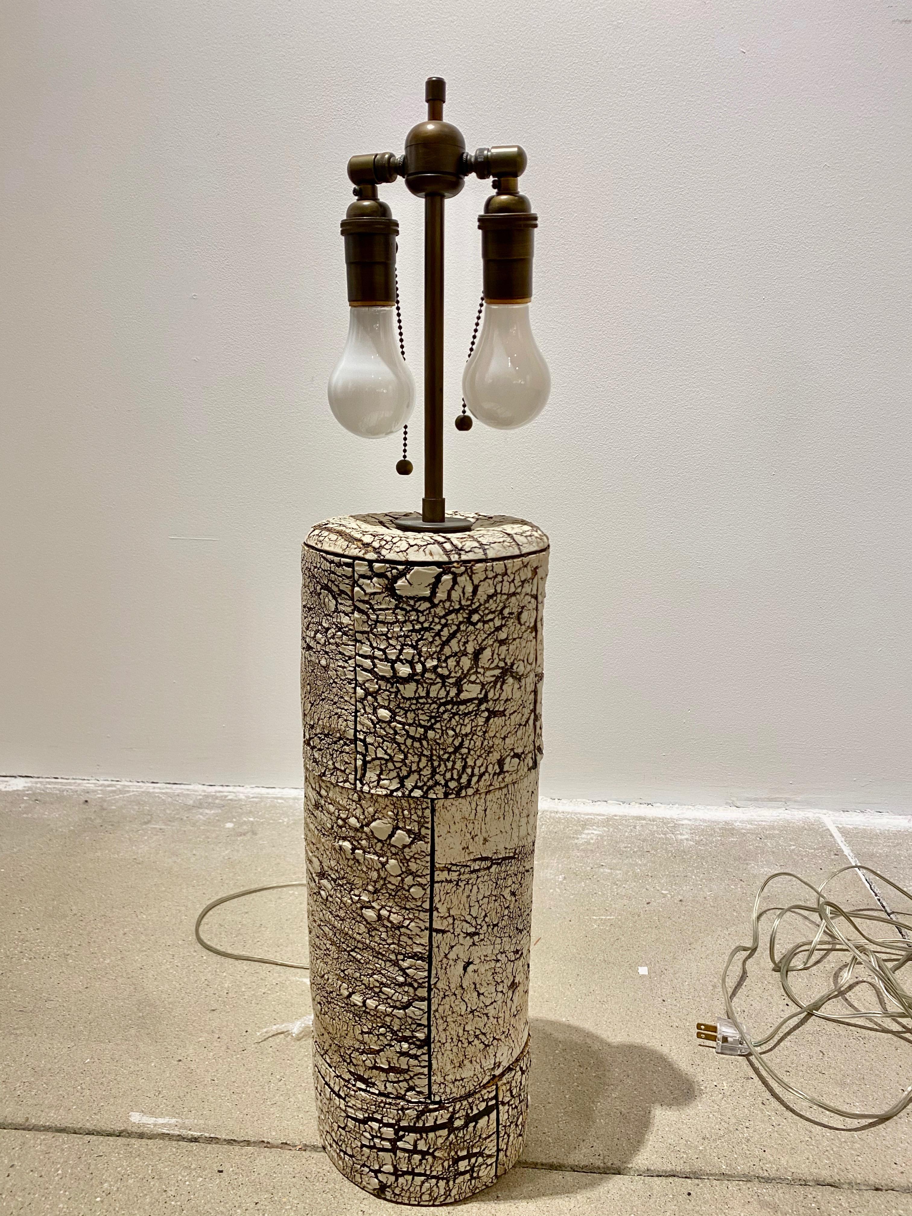 Peter Lane is an American ceramic artist who has exhibited at FOG design and art fair and at the Bass Museum of Art. He introduced the birch bark finish in mid-2000s and this lamp was produced a little later. Signed on back. White linen drum shade.