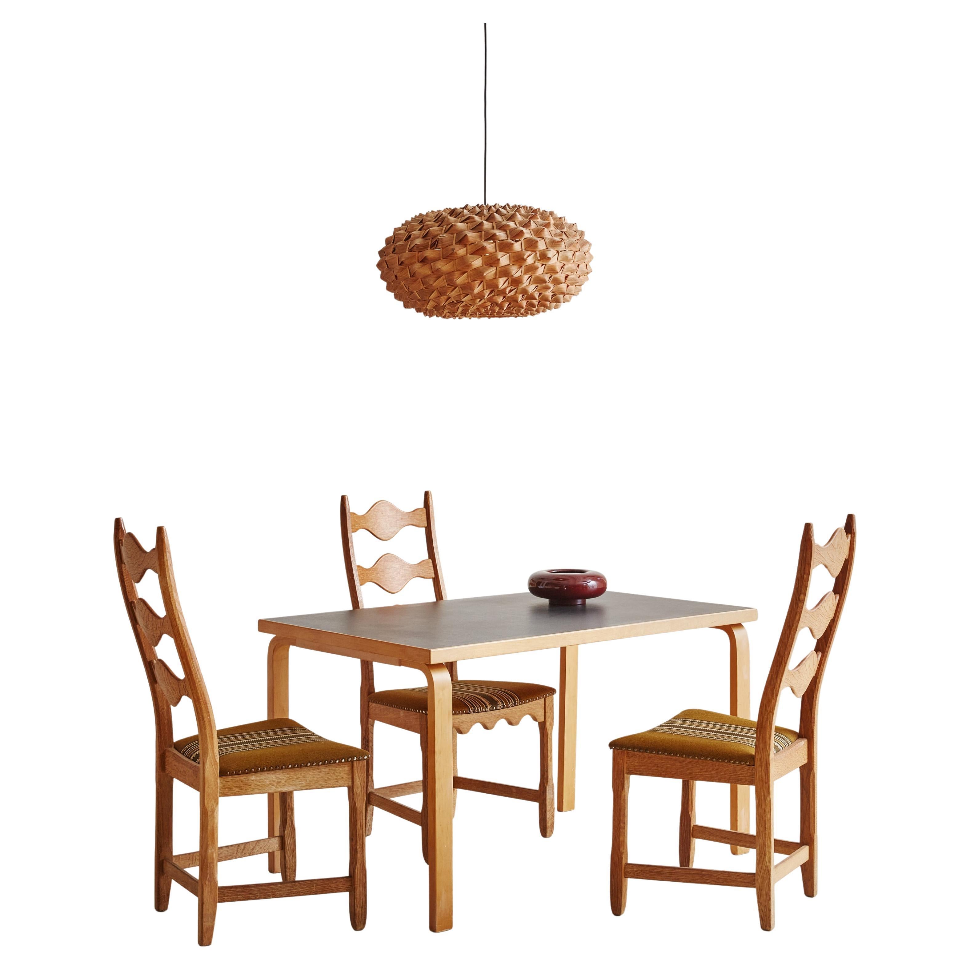 A beautifully crafted ‘81B’ rectangular dining table designed by Alvar Aalto for Artek in the 1950s. This Scandinavian Modern table is constructed of solid Finnish birch wood in a warm, blonde hue. The lacquered frame features four bentwood legs and