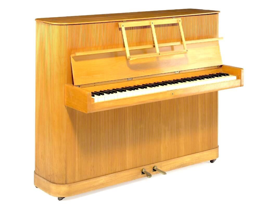 This upright piano was made in 1930's by Kaj Gottlob, Danish architect and designer known for his introduction of neo-classicism in architecture and furniture design in 1920's where regarding the latter he worked with cabinet-maker I.J Iversen and